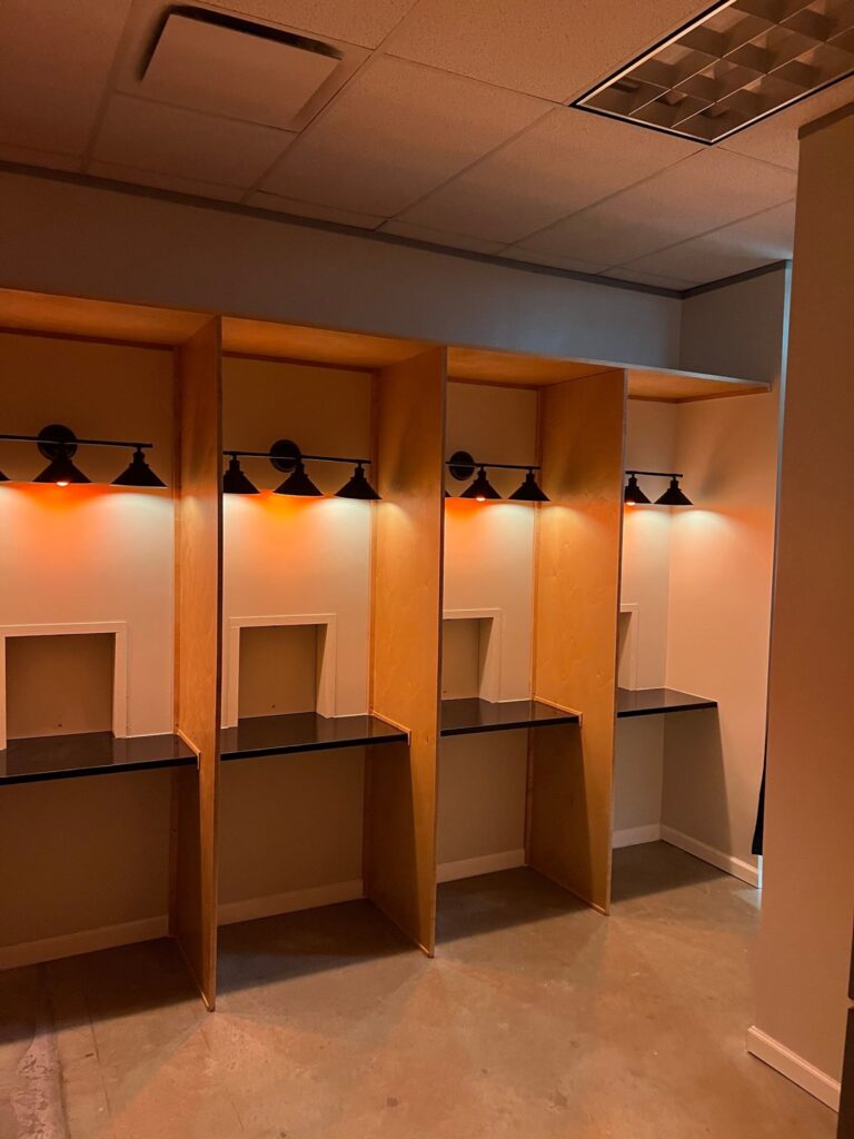 Custom millwork club lockers in a golf lounge commercial build-out